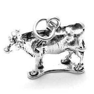 COW CHARM IN HEAVY 3D STERLING SILVER.